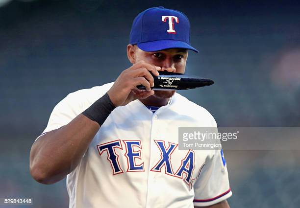 ARLINGTON, TX - MAY 09:  Adrian Beltre #29 of the Texas Rangers smells a piece of a broken bat against the Chicago White Sox in the top of the first inning at Globe Life Park in Arlington on May 9, 2016 in Arlington, Texas.  (Photo by Tom Pennington/Getty Images)